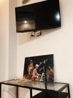 Telewizja i/lub zestaw kina domowego w obiekcie Spagna Gregoriana 46