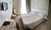 Posteľ alebo postele v izbe v ubytovaní Hotel Roma