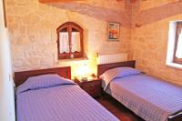 A bed or beds in a room at The Vivian - Luxury Stone Villa