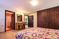 A bed or beds in a room at The Vivian - Luxury Stone Villa