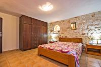 A bed or beds in a room at The Vivian - Luxury Stone Villa