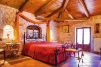 A bed or beds in a room at The Vivian - Luxury Stone Villa