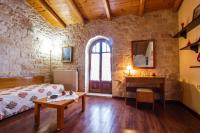 A bed or beds in a room at The Vivian - Luxury Stone Villa
