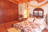 A bed or beds in a room at The Vivian - Luxury Stone Villa