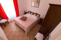 Łóżko lub łóżka w pokoju w obiekcie Agriturismo Casale del Contadino