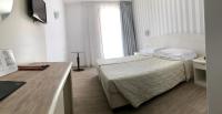 Posteľ alebo postele v izbe v ubytovaní Hotel Roma