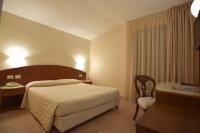Posteľ alebo postele v izbe v ubytovaní Hotel Roma