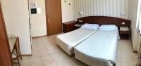 Posteľ alebo postele v izbe v ubytovaní Hotel Roma