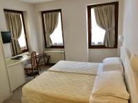 Posteľ alebo postele v izbe v ubytovaní Hotel Roma