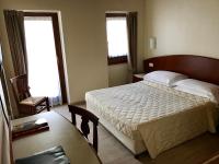 Posteľ alebo postele v izbe v ubytovaní Hotel Roma