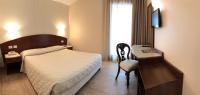 Posteľ alebo postele v izbe v ubytovaní Hotel Roma