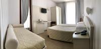 Posteľ alebo postele v izbe v ubytovaní Hotel Roma