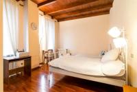 Posteľ alebo postele v izbe v ubytovaní Villa Magnolia Lago Maggiore