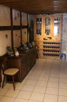 een keuken met een aanrecht en een tafel en een stoel bij Gasthaus Sonne in Schliengen