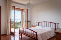 Postel nebo postele na pokoji v ubytování Appartamento Luisa - Vista Lago