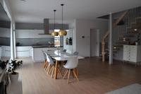 a kitchen and dining room with a table and chairs at Passivhaus Hannover Messe in Hannover