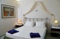 Postel nebo postele na pokoji v ubytování Vasilaras Hotel