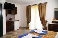 Postel nebo postele na pokoji v ubytování Vasilaras Hotel