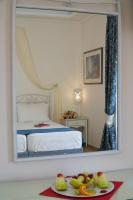 Postel nebo postele na pokoji v ubytování Vasilaras Hotel