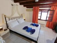 Postel nebo postele na pokoji v ubytování Vasilaras Hotel