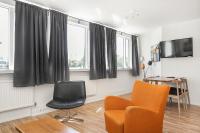 TV a/nebo společenská místnost v ubytování Stay Apartments Einholt
