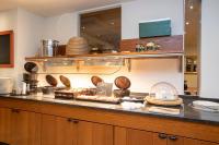 a kitchen with a counter with some food on it at Fletcher Hotel-Restaurant Wolfheze in Wolfheze