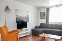 TV a/nebo společenská místnost v ubytování Stay Apartments Einholt