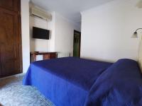 Postel nebo postele na pokoji v ubytování Hotel Doña Carmen
