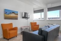 TV a/nebo společenská místnost v ubytování Stay Apartments Einholt