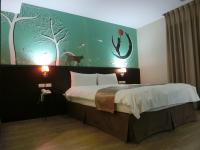 Postel nebo postele na pokoji v ubytování Travel Art Inn