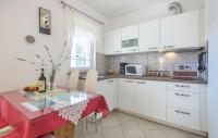 Kuchyňa alebo kuchynka v ubytovaní Apartmani Lisičak A2+2