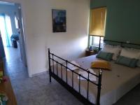Łóżko lub łóżka w pokoju w obiekcie Marianos Apartments