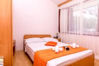 Posteľ alebo postele v izbe v ubytovaní Apartments Mira Mark