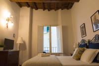 Posteľ alebo postele v izbe v ubytovaní Dante's Rooms