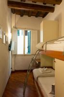Posteľ alebo postele v izbe v ubytovaní Dante's Rooms