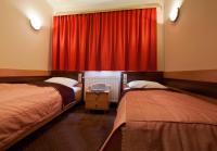 Łóżko lub łóżka w pokoju w obiekcie Hotel Vitalia