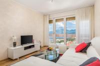 Televízia a/alebo spoločenská miestnosť v ubytovaní Orchidea apartment