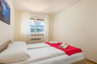 Posteľ alebo postele v izbe v ubytovaní Orchidea apartment
