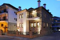 a large stone building with lights on at Guesthouse Konstantinos Bakaris in Kastoria