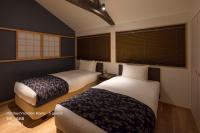 THE MACHIYA VILLA 三条しらかわ小路にあるベッド