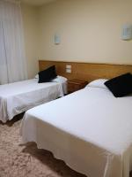 Postel nebo postele na pokoji v ubytování Hotel Ronsel