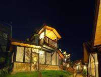 a large building with a balcony at night at Sea of Clouds Vacation Villa in Ren&#39;ai