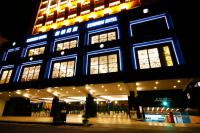 a blue building with lights on it at night at Kindness Hotel-Qixian in Kaohsiung