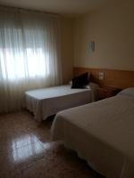 Postel nebo postele na pokoji v ubytování Hotel Ronsel