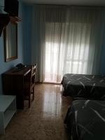 Postel nebo postele na pokoji v ubytování Hotel Ronsel