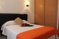 Postel nebo postele na pokoji v ubytování Hotel Ronsel