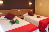 Postel nebo postele na pokoji v ubytování Hotel Ronsel