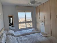 Postel nebo postele na pokoji v ubytování En el cielo de Benidorm - Alteanos V