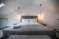 A bed or beds in a room at Anemos Luxury Apartments