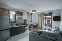 A kitchen or kitchenette at Anemos Luxury Apartments